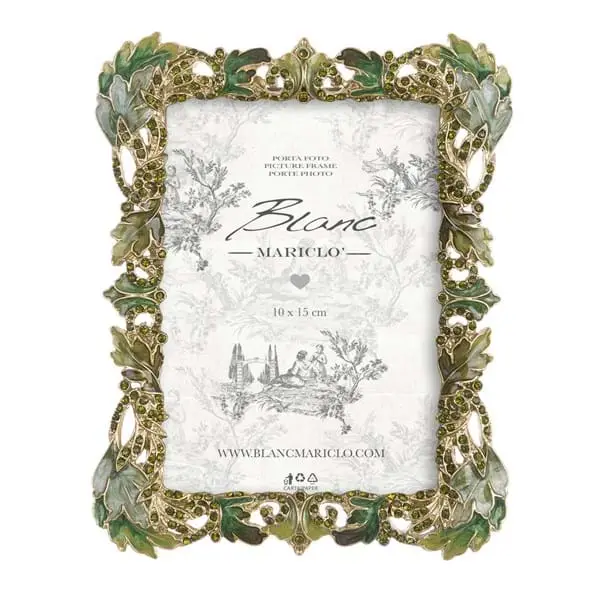 Cornice con brillantini e foglie verdi
