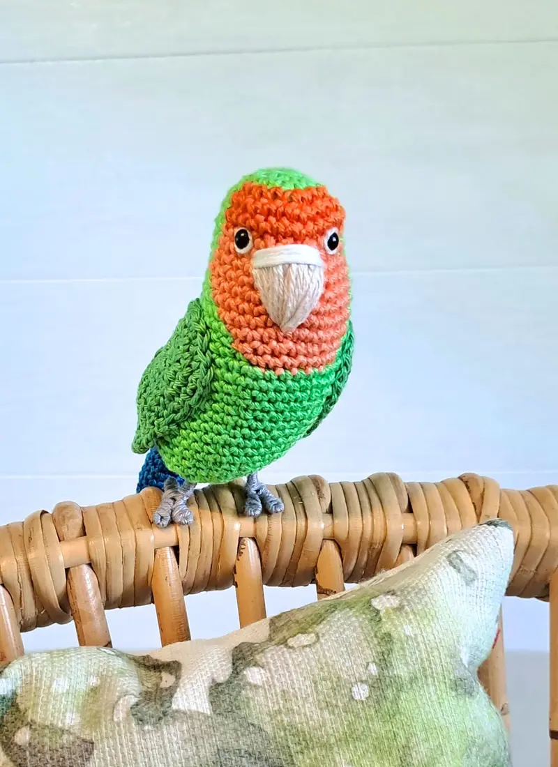 Crochet Peach-faced lovebird plush toy