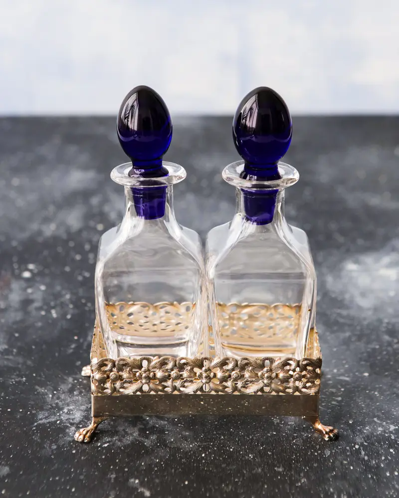 Olio e aceto in cristallo e base argento cassetti