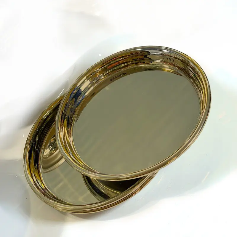 Set di 2 sottobicchieri e piattini in ottone lucido dal design minimal